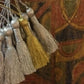 Silver and gold tassels