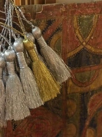 Silver and gold tassels