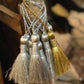 Silver and gold tassels