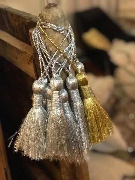 Silver and gold tassels